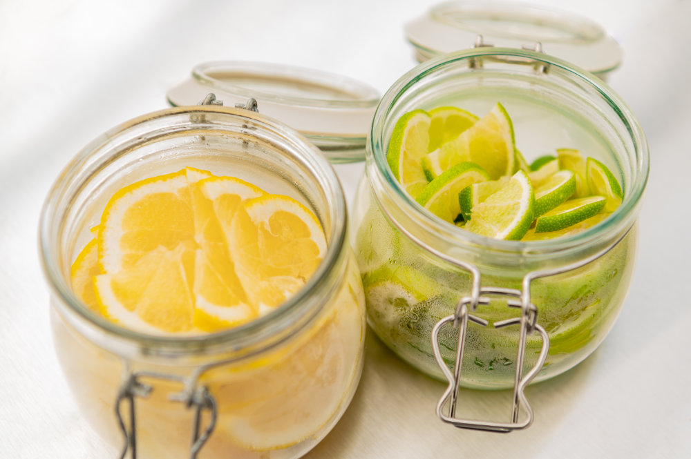 Neptune Bars sliced lemon and limes in jars