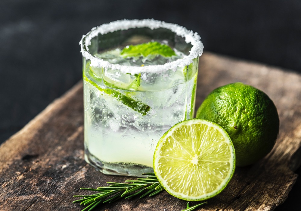 Margarita in salt-lined glass with lime